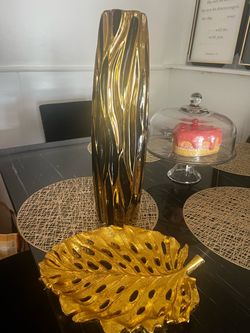 Black and gold vase with gold leaf