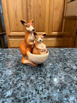 Ceramic Magnetic Kangaroo With Baby Joey in Pouch pair of salt and pepper shakers.  Brand new never used.  Brand Westland.