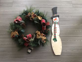 Christmas decor wreath with a luminous garland and a wooden snowman, for $ 15