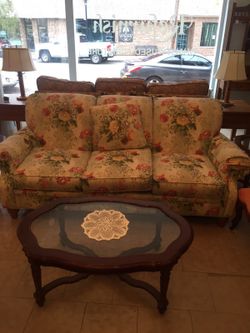 Floral couch by Clayton Marcus