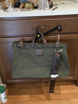 Line of trade Olive Canvas Duffel with Brown Leather Trim and Detachable Strap