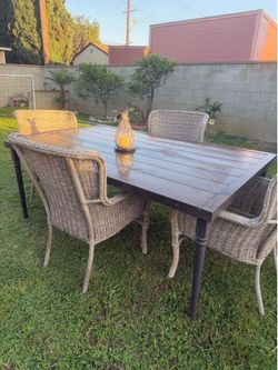 Patio table with bamboo chairs.