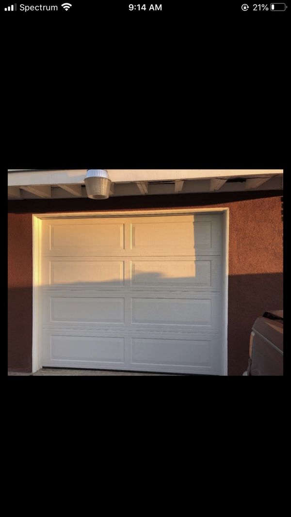 1 car garage door for sale ! 6.9 feet tall , 8 feet wide