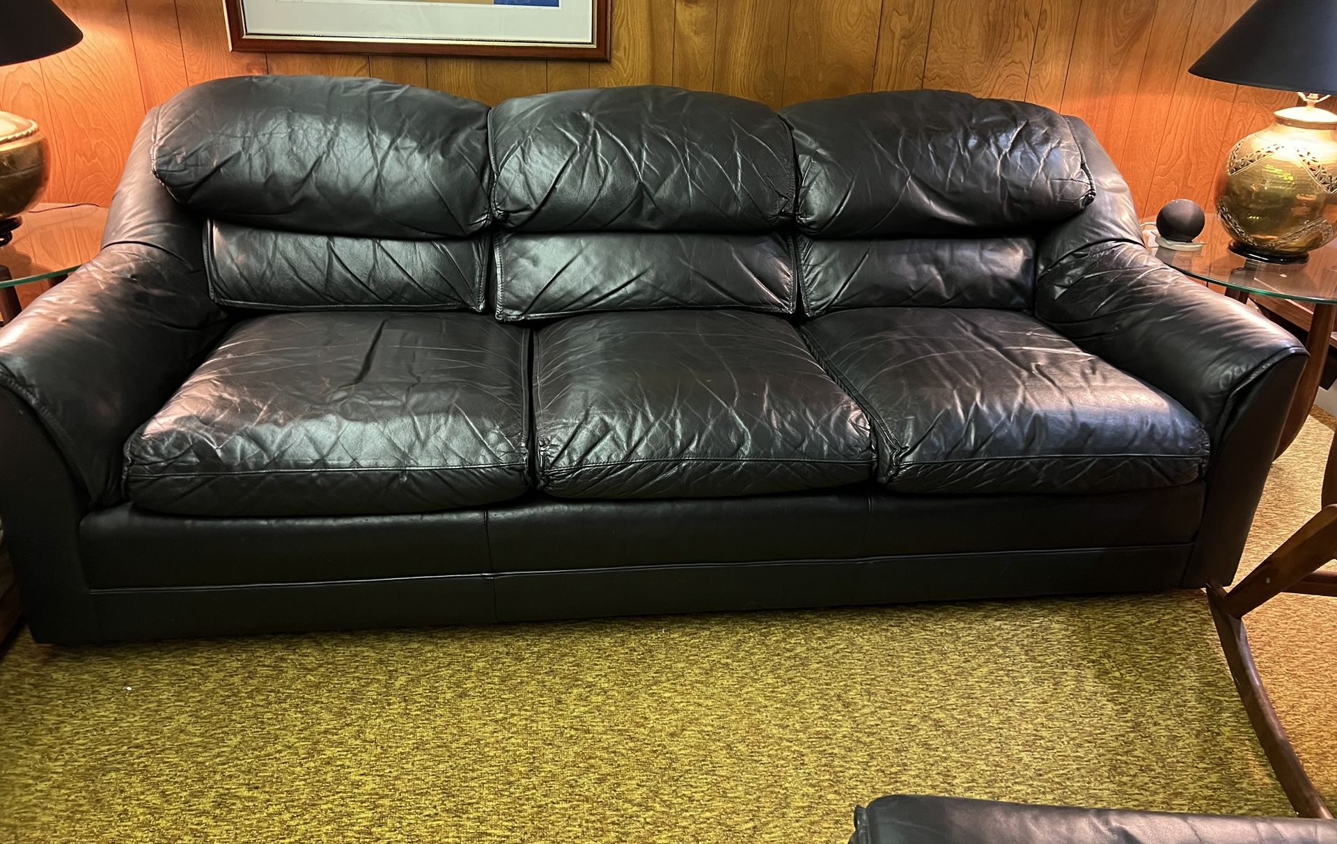 Hancock and Moore - Sofa with matching ottoman in Black leather. both on wheels