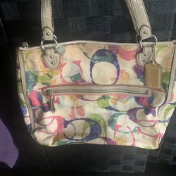 Canvas and leather handbag titled 'Poppy Stamped Signature C Hallie East/West Tote' by Coach
