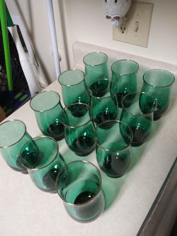 12 vintage green drinking glasses.