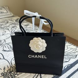 chanel shopping bag included flower and Ribbon . see pics for size.