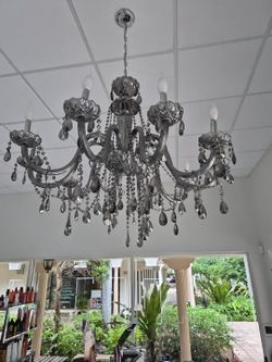 Beautiful large Maria Theresa–style chandelier featuring smoky-gray glass arms, decorative crystal bowls, and cascading teardrop crystals.