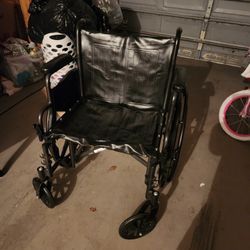 Oversized wheelchair with legs and foot petals
