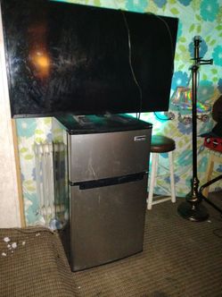 Insignia tv and magic chef refrigerator.