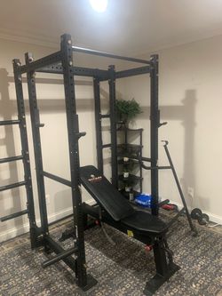 Like new T3 Titan 6 post Powertec Rack with 8 weight holders and 2 barbell holders and dip bar cross