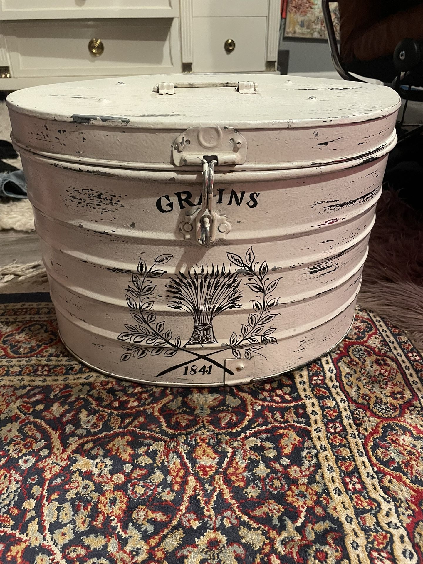 Vintage aluminum storage container says “Grains”, with lockable latch