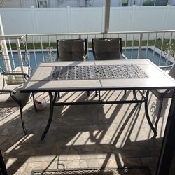 Patio dining set (1 table and 4 chairs ) in good condition