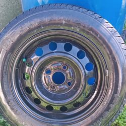 1rim 1tire 185/65/14  in ok Condition $ 40 obo