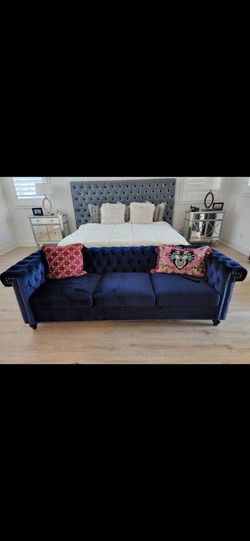 Blue tufted couch