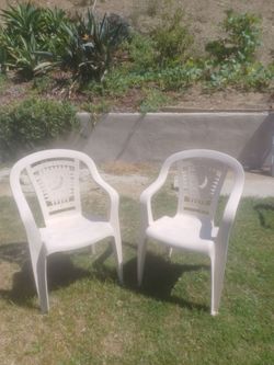 2 outdoor plastic chairs both for $25