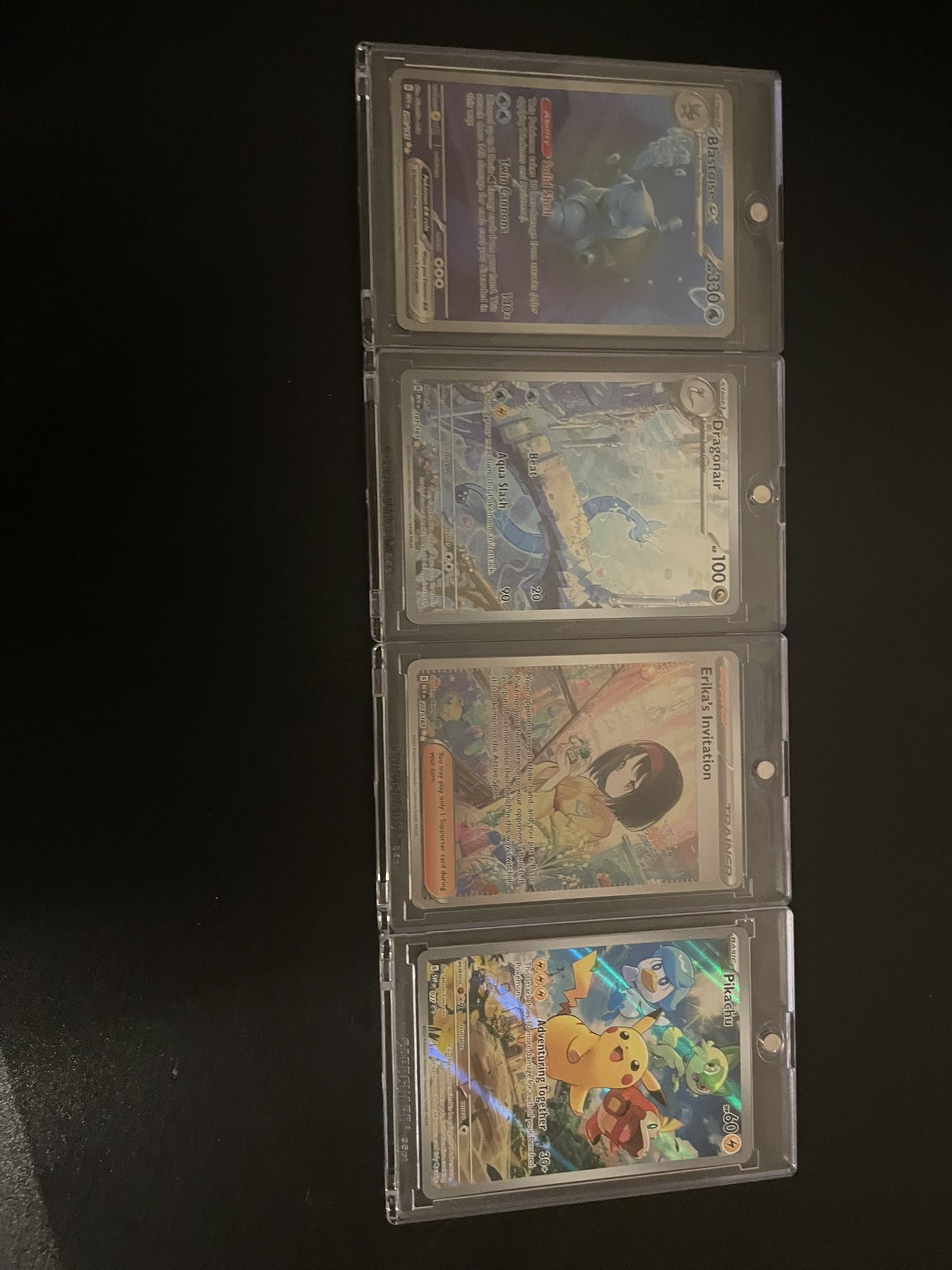 Blastoise EX, Erika Invitation, Dragonair, Pikachu.