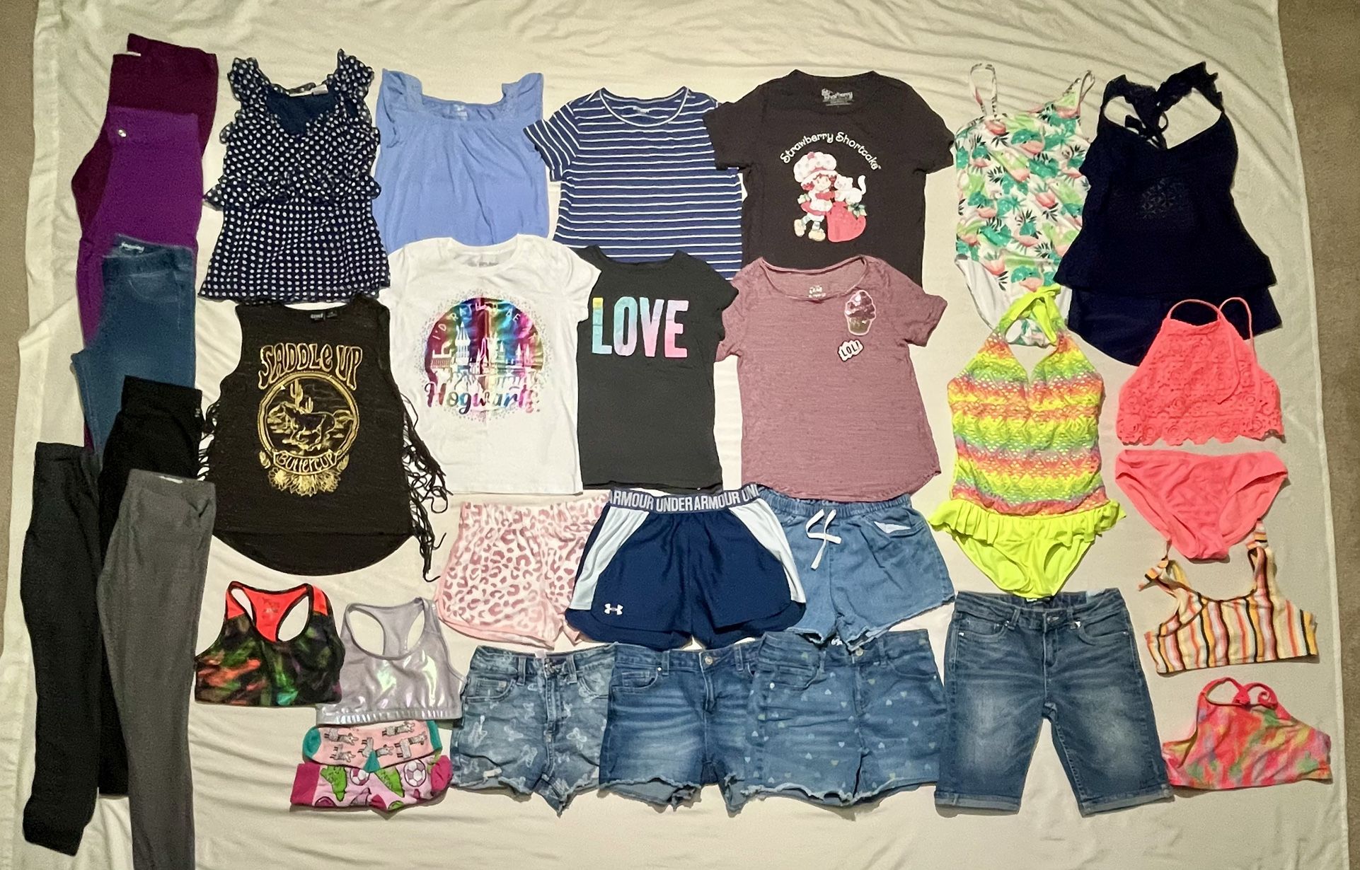 Bundle of girls summer clothing size Lg swimsuits, shorts, tops, sport bra, etc