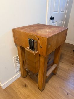 Vintage butcher block cutting board on wheels