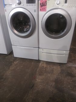 SALE PRICE !!! LG front load washer and dryer set with pedestals in excellent conditions
