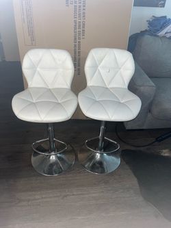 White swivel bar stools