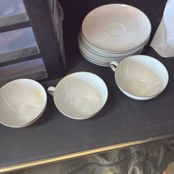 6 tea cup saucers and 3 tea cups style house