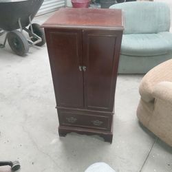 Vintage jewlery armoire stand. 