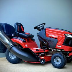 Brand new CRAFTSMAN T2200K Turn Tight 42-in 20 -HP Kohler V-twin Gas Riding lawn mower comes with extra Bagger on it. 