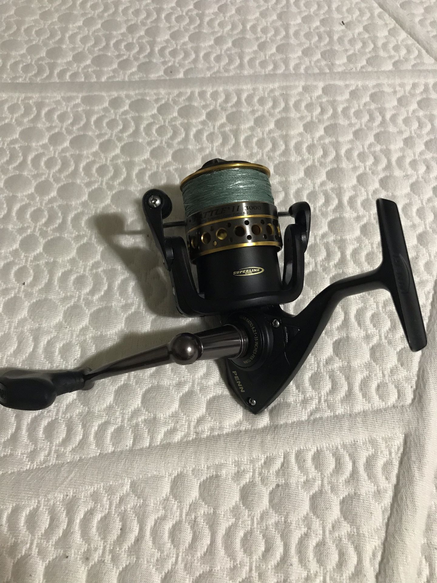 Penn battle II fishing reel used one time .. comes with braided line 3000 model