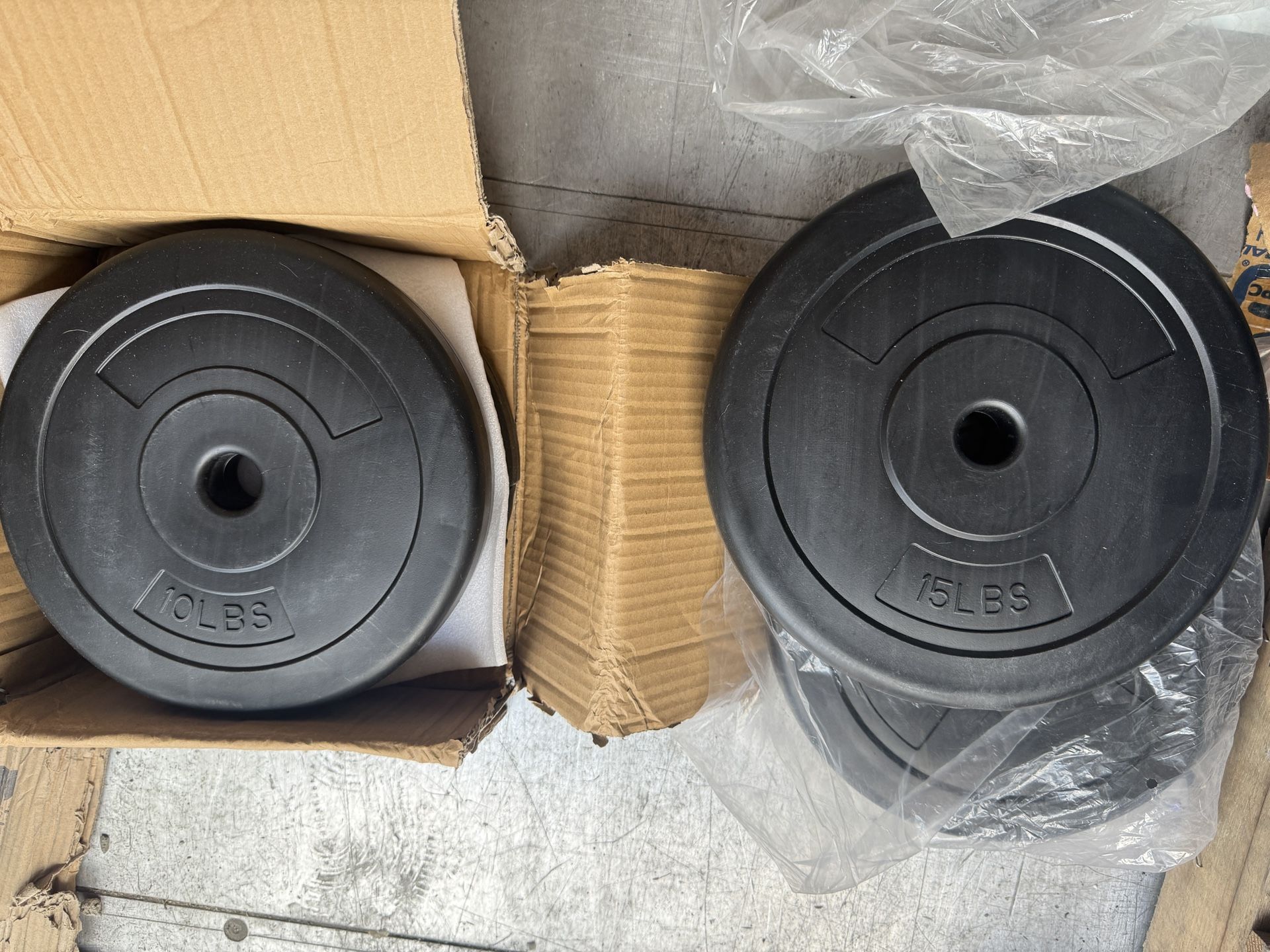 Set Of 15 pound and 10 pound 1 inch dumbbell plate plates