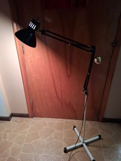 Floor standing adjustable lamp
