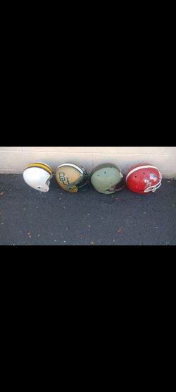 4 football helmets