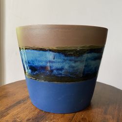 Glazed and painted terracotta plant pot. Painted in bunker hill blue chalk paint and finished with wax.