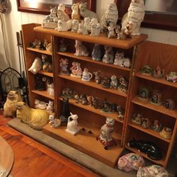 Collectible porcelain cat figurines. Various prices. Inquire if interested