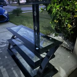 Black glass TV Stand $50 obo please look at the pictures for measurements All my sales are final
