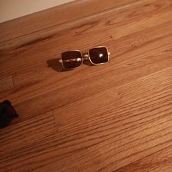 Vintage Men's Cool-Ray Polaroid Sunglasses featuring a gold-toned metal frame. 