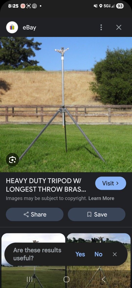 Tripod Sprinkler And Goodyear Red Hose