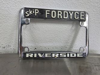 Vintage metal Skip Fordyce motorcycle license plate frame
