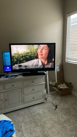 50 “ Sharp TV with stand /remote— 43” Wide X 27” High 