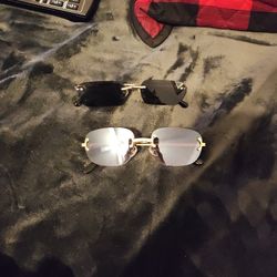 Pair of gold framed sunglasses