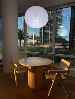 Moon Dining Table with Rattan Chairs