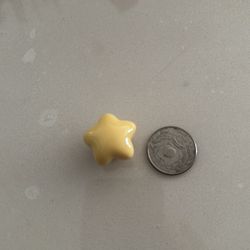 One yellow star Crocs shoe charms