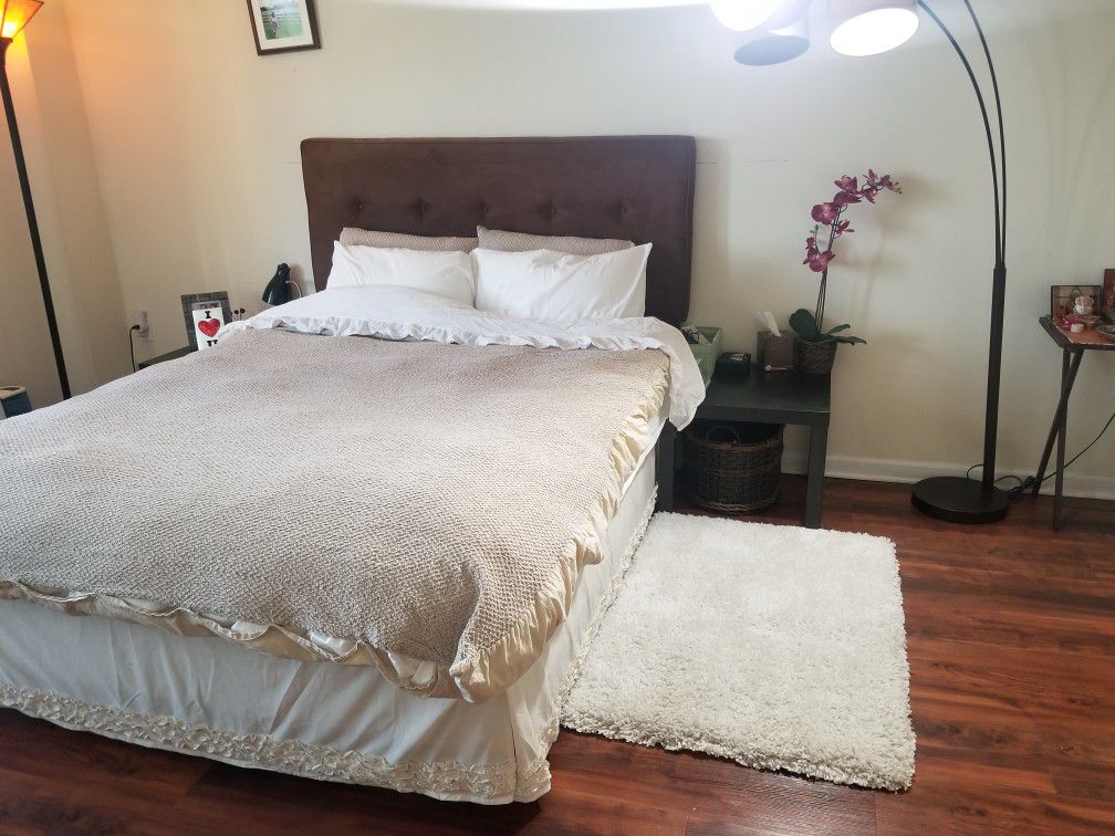 Queen size bed with a head board and extra firm mattress