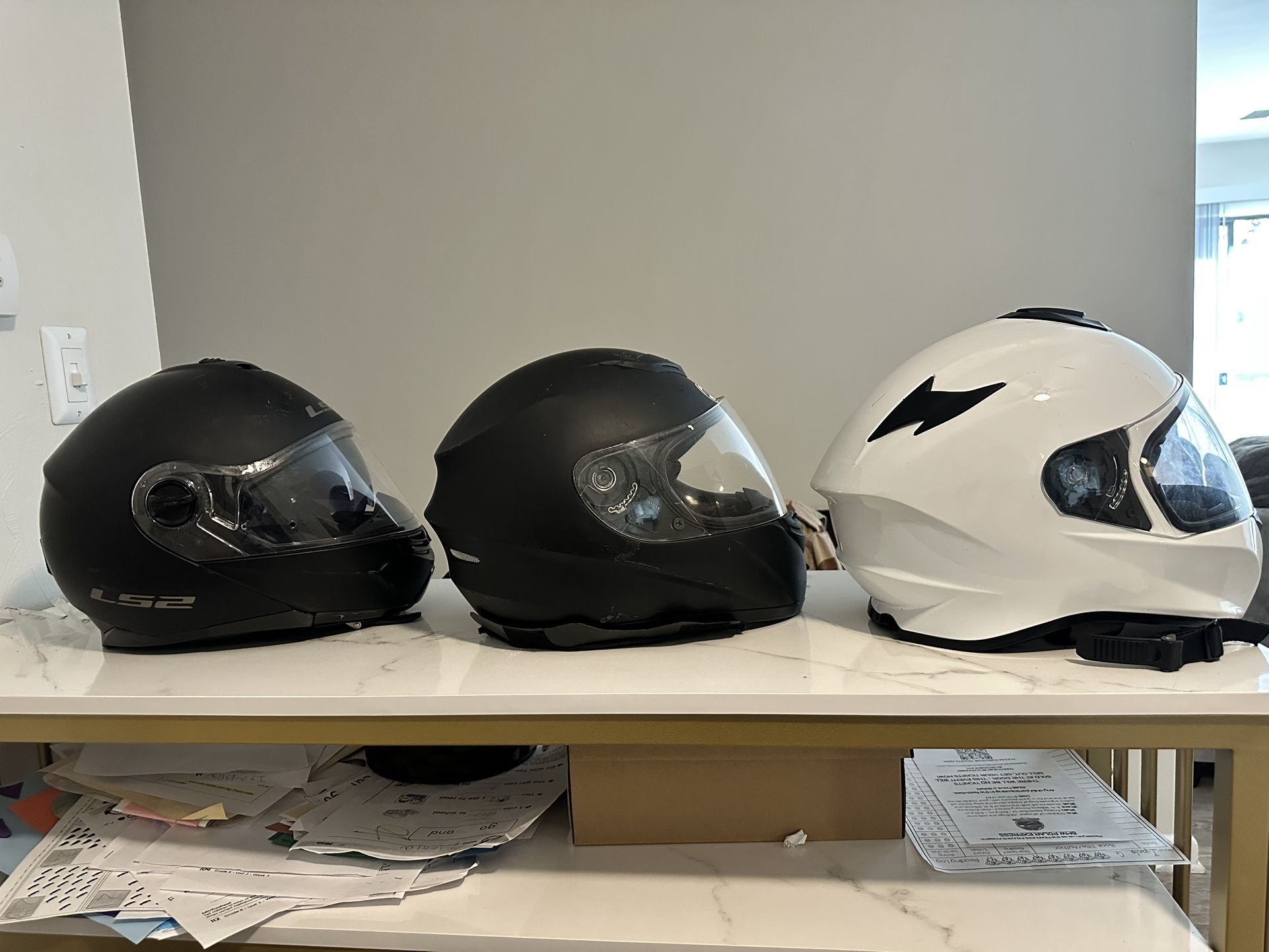 3 motorcycle helmets