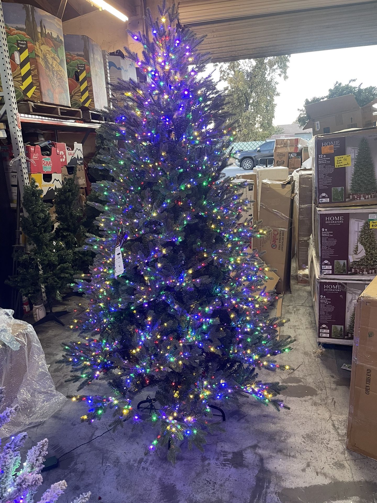 Home Accents Holiday 7.5 ft. Starry Light Fraser Fir Flocked LED Pre Lit Artificial Christmas Tree with 1500 Color Changing Lights