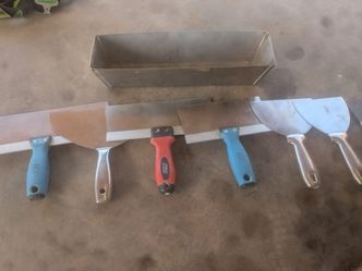 Drywall knives and mud pan.