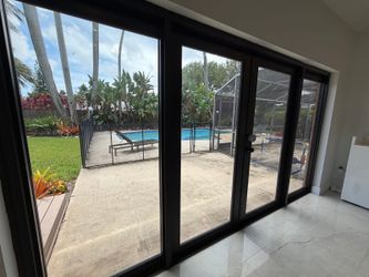 Luxury Hurricane Impact Glass Door System â€“ Modern Black Aluminum