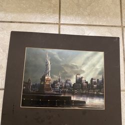 A beautiful picture of New York with the Statue of Liberty on it