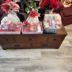 Mother's Day Baskets Bath and Body plus extra  stuff   Basket   1 st and 2nd basket 35.00  3rd basket 30.00 The 3 Baskets  in the back 30.00 each