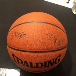 Signed Basketball By Zak Randolph and Quintel Woods.